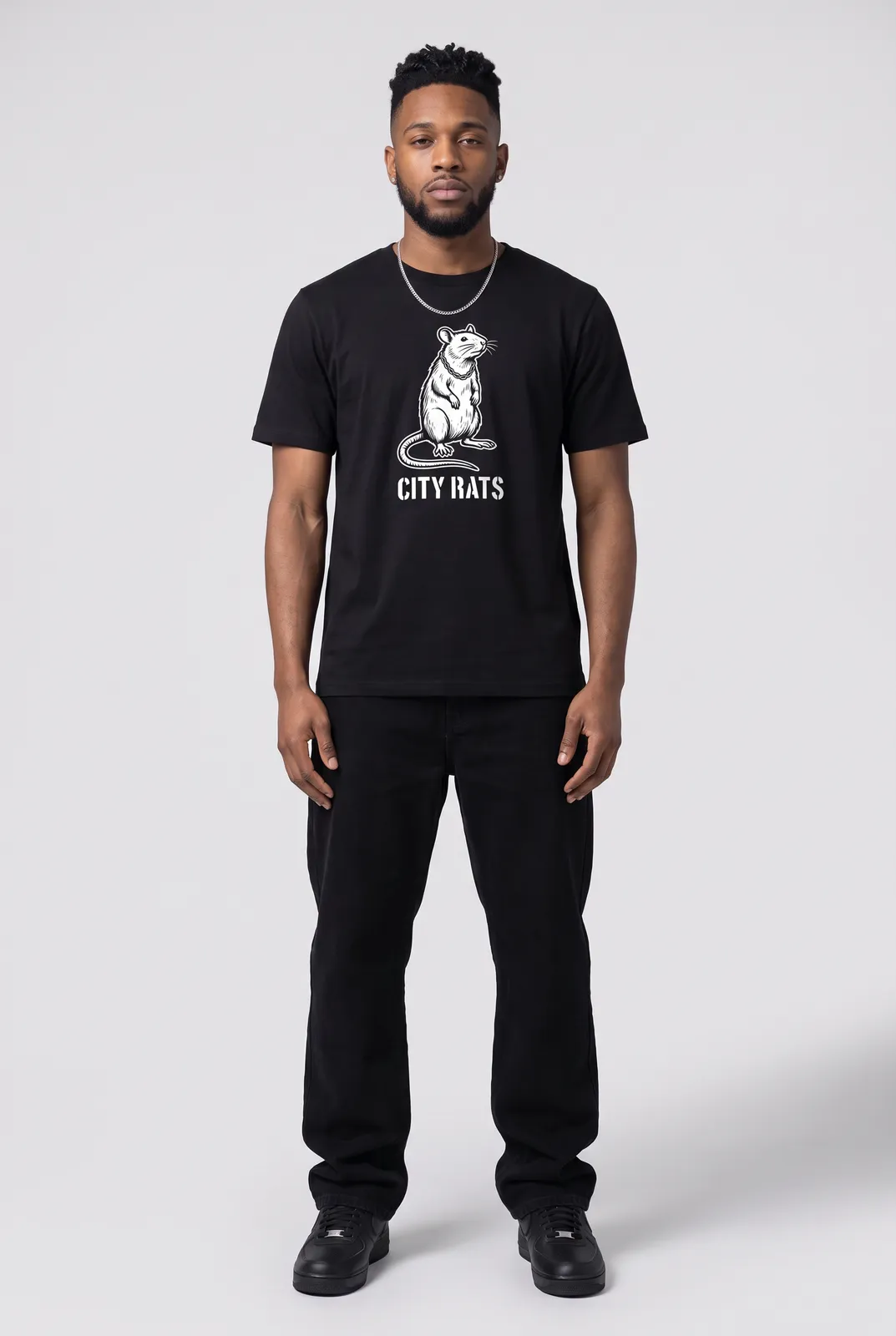 Malik Carter wearing the CITY RATS Tee in Black, front hero